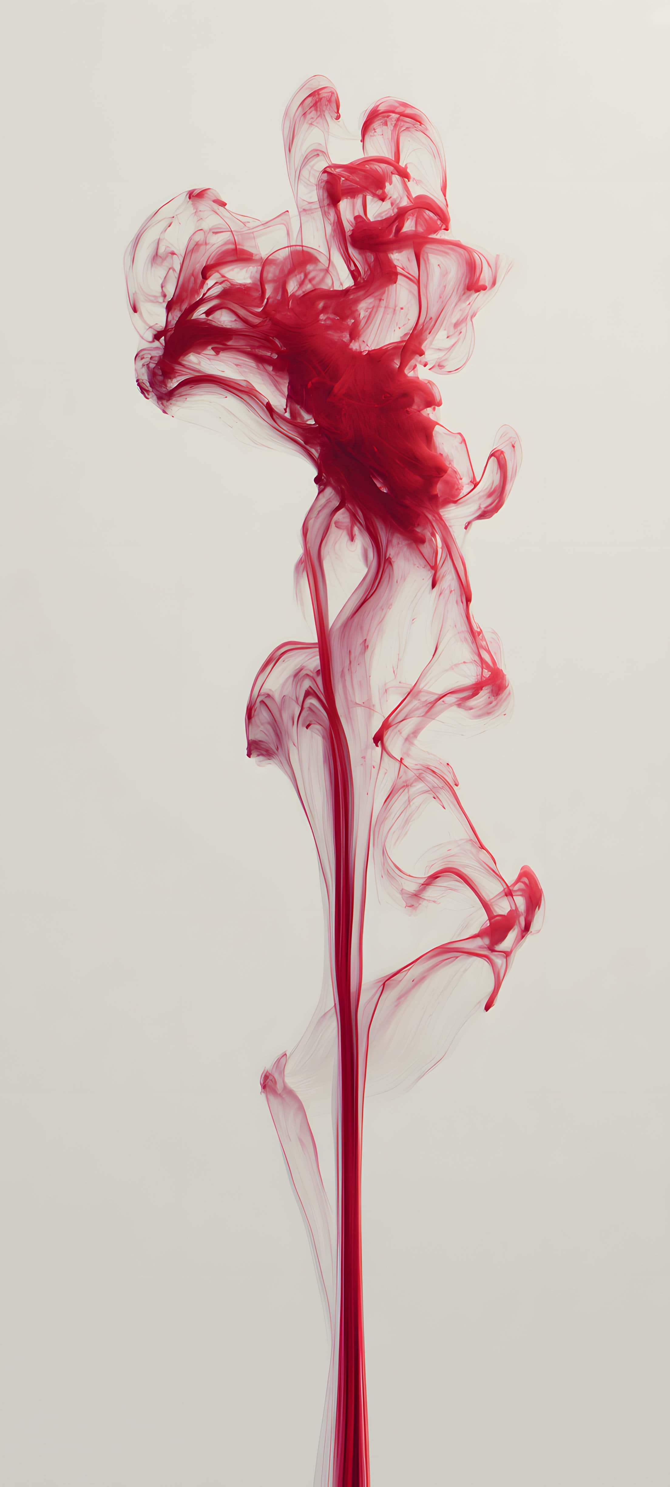 Abstract red ink splatter on a white background, creating a vibrant and dynamic artistic mobile wallpaper.